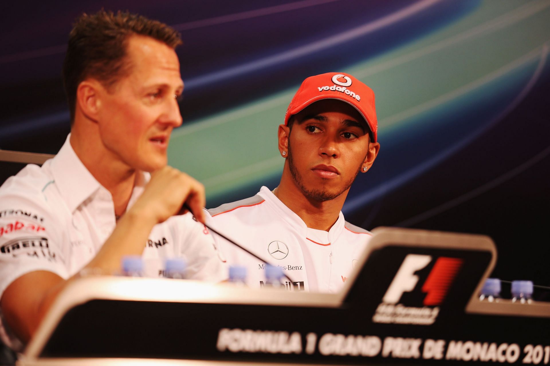 Lewis Hamilton (R) listens as Michael Schumacher (L) talks during Monaco Grand Prix. Source: Getty